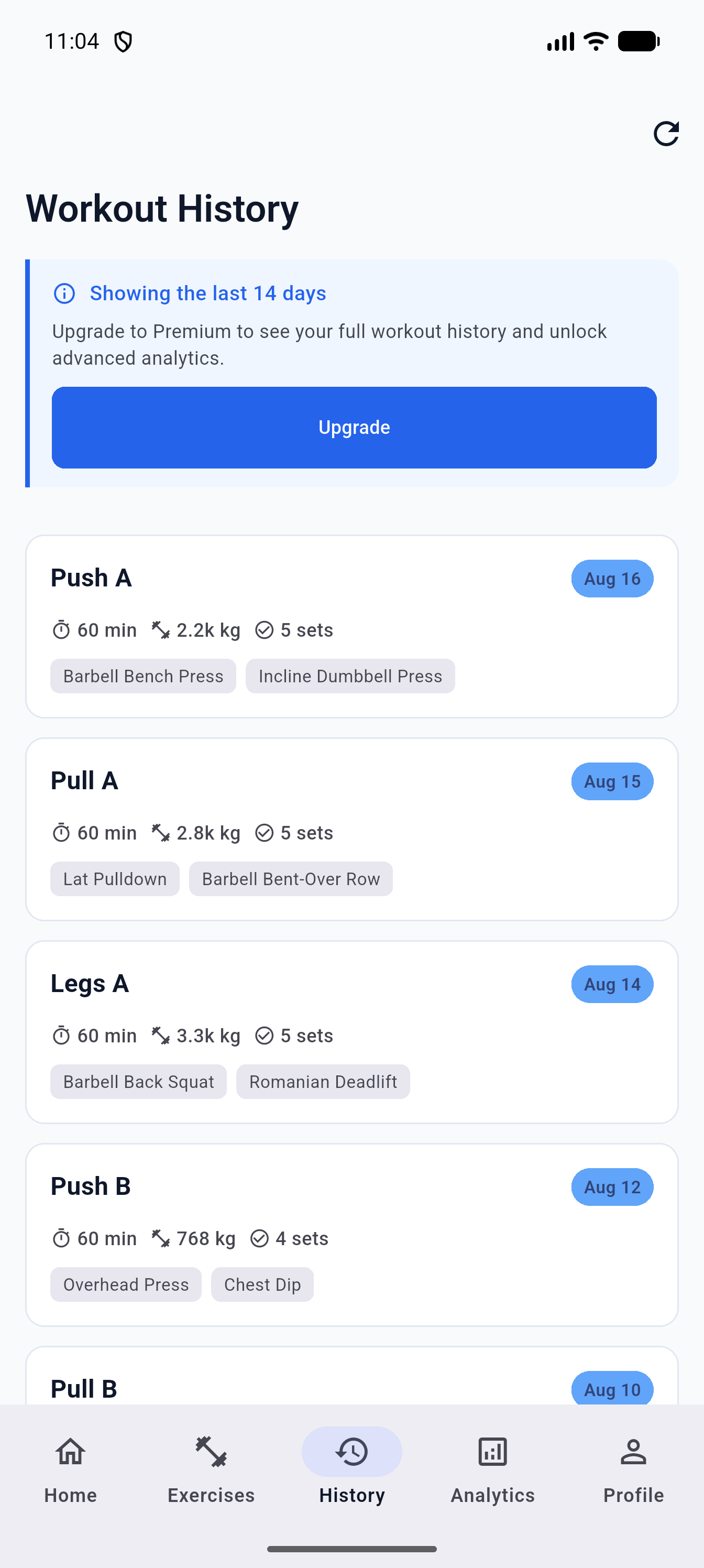 Workout history screen displaying chronological past workouts with volume and duration badges
